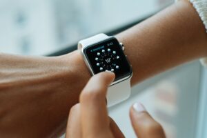 An apple watch on a person's arm.