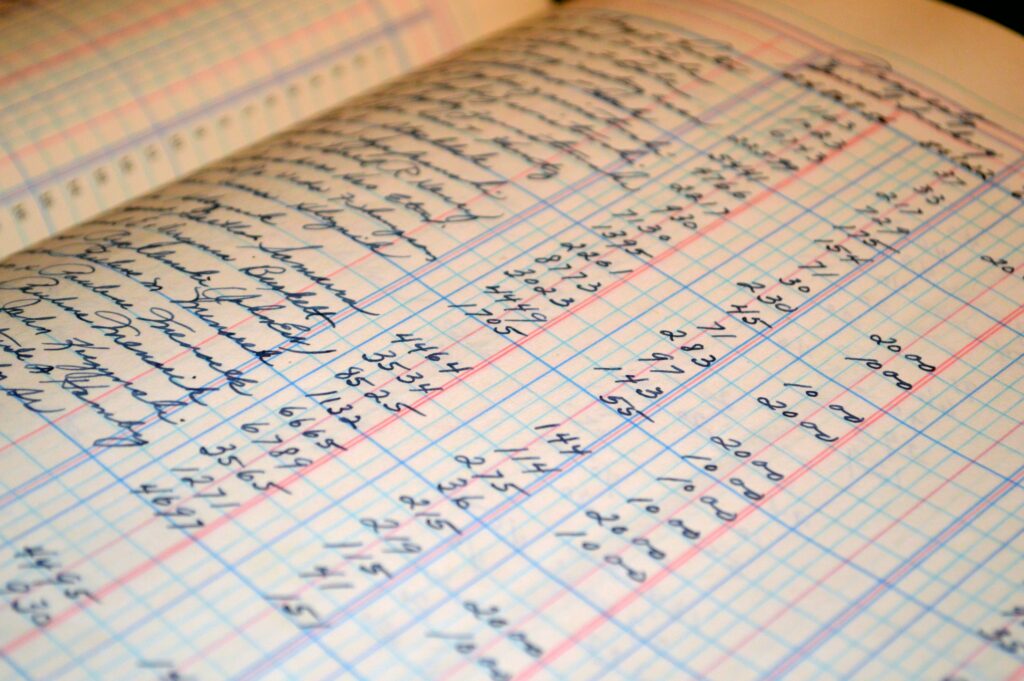 Close up photograph of handwritten financial records.