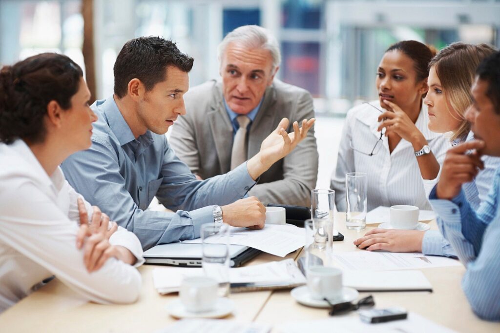 Coworkers engaged in a team meeting.