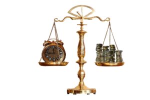 A balance scale with a clock on one side and a stack of coins on the other side.