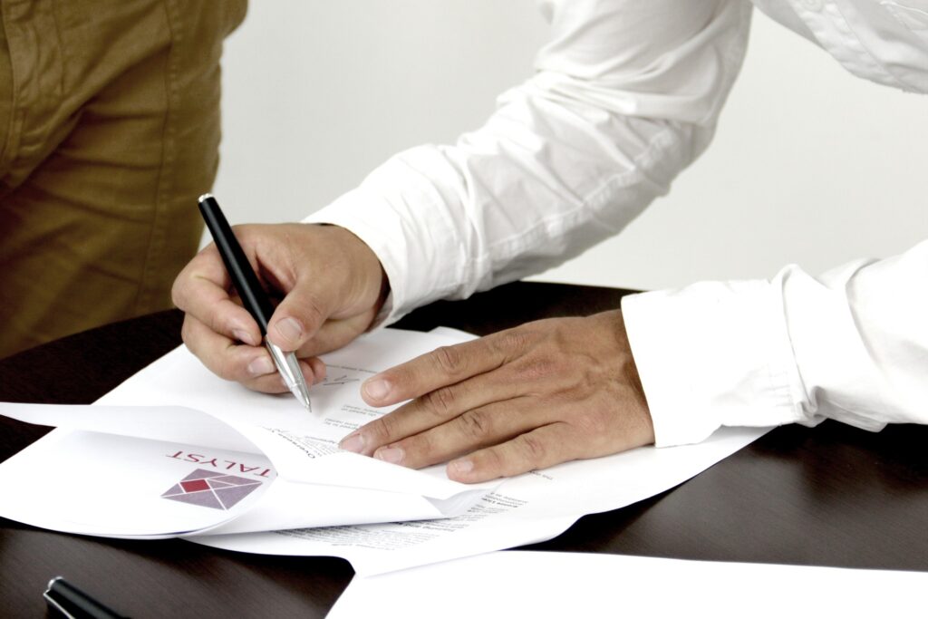 A person signing a lease.