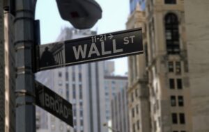 A street sign that says "Wall St.".