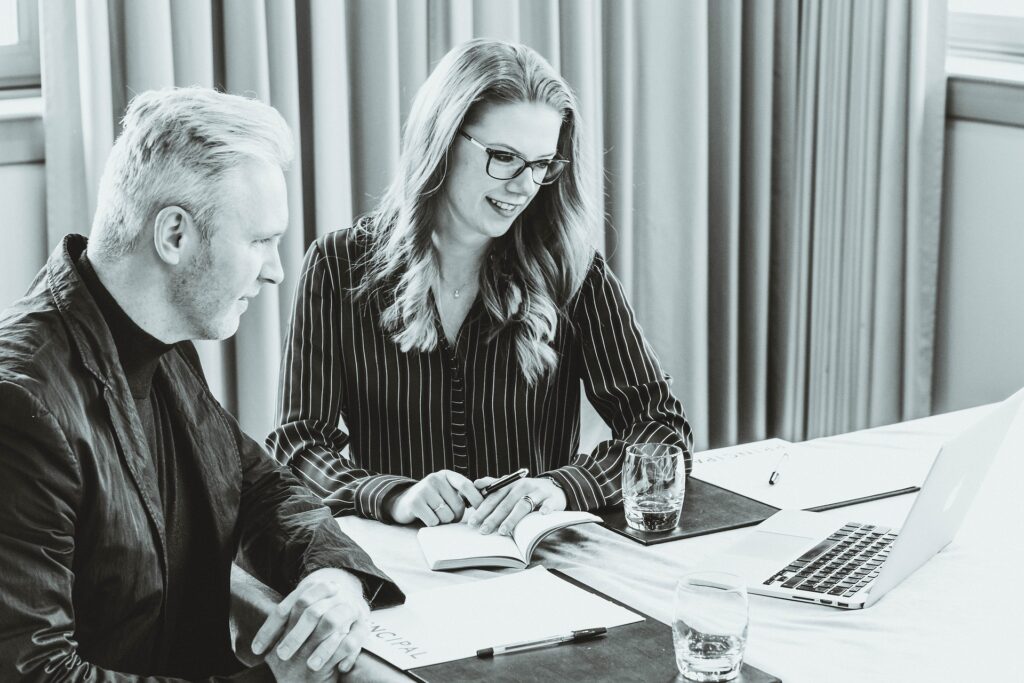 Two coworkers participating in a video conference.