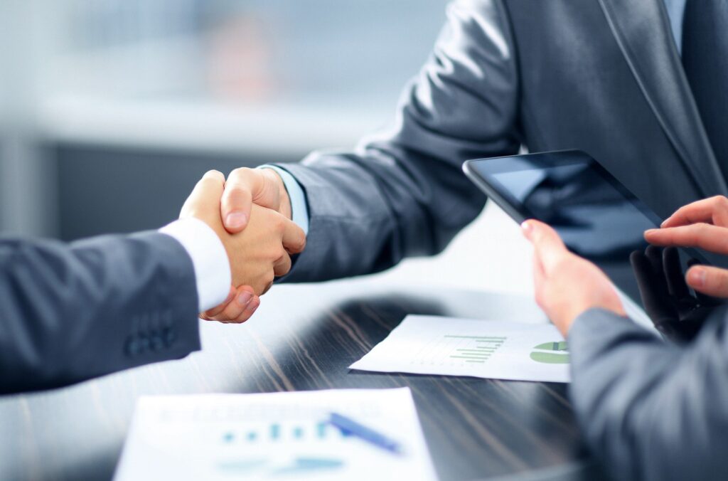 Two business associates shaking hands.