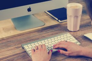 A person typing on a keyboard.