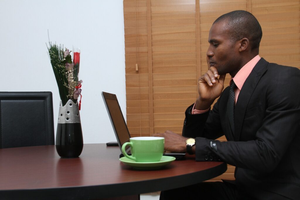 A business man sitting at his laptop.