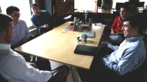 A group of coworkers sitting around a table.