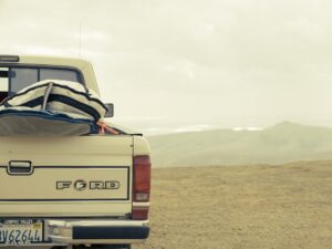 A view from behind of a Ford truck.