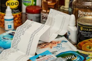 A paper receipt in a group of groceries.