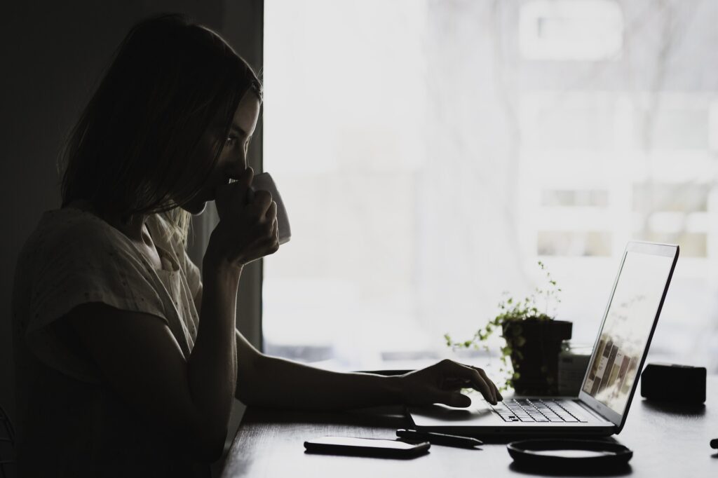 A woman working at her laptop.